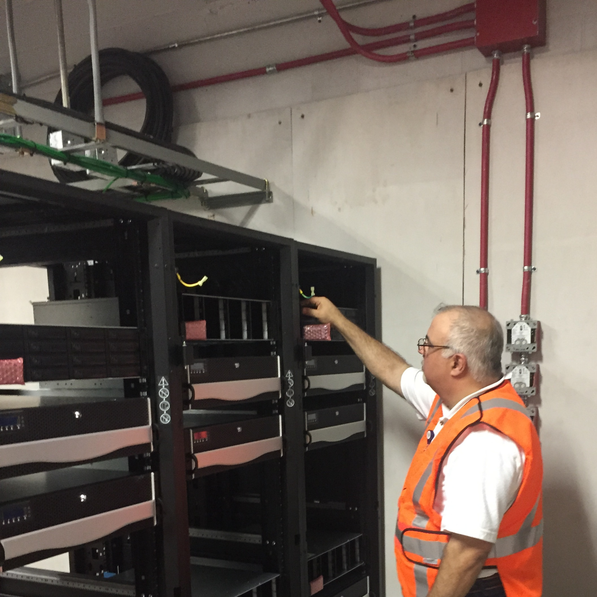 Dave Gitter working in an infrastructure room at Fort Lauderdale-Hollywood International Airport